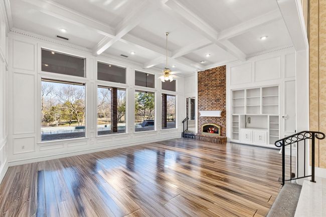 Enhanced photo of Great room with hardwoods instead of carpet | Image 18