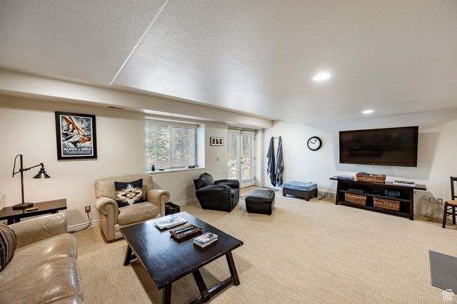 Workout room featuring recessed lighting, light carpet, and a sink | Image 25