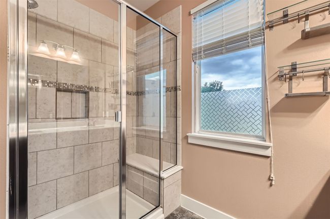 Bathroom featuring a stall shower | Image 16