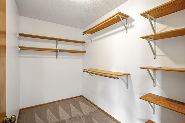 Walk in closet already has some organizational components! | Image 16