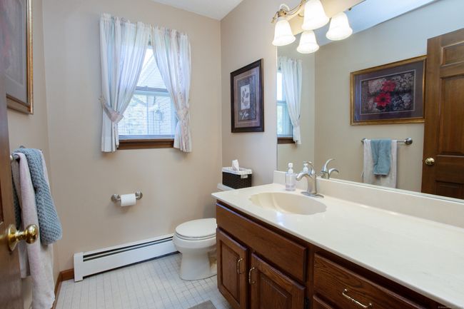 Main level bathroom near garage and mudroom | Image 33