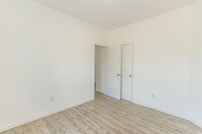 Unfurnished room featuring light wood-type flooring and baseboards | Image 24
