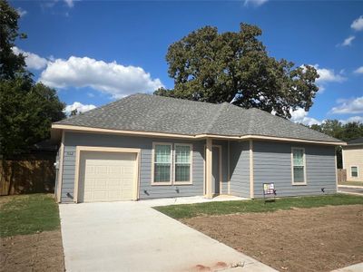 Single story home featuring a garage | Image 1