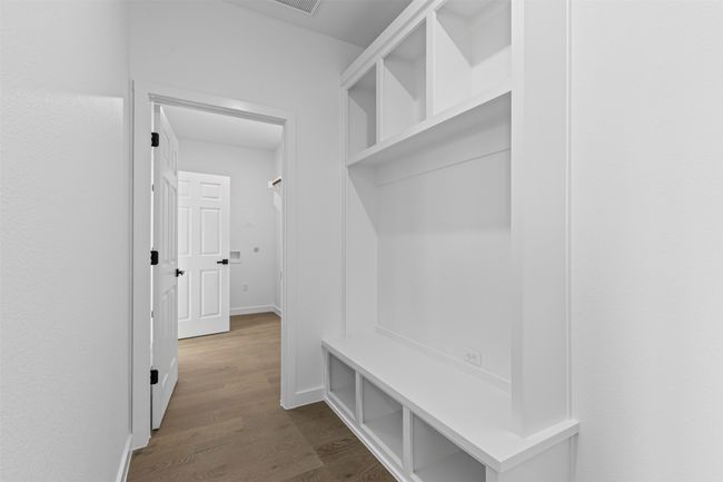 Mudroom featuring dark wood-type flooring | Image 21