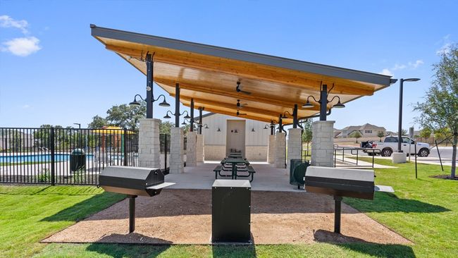 View of community with fence and a yard | Image 39