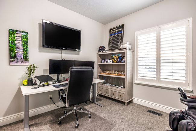 Office area featuring carpet floors and a textured ceiling | Image 24