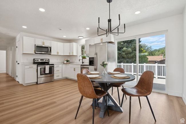 Dining room with sliding door to the deck | Image 5