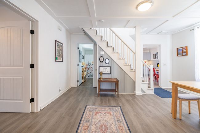 Staircase with wood finished floors and baseboards | Image 8