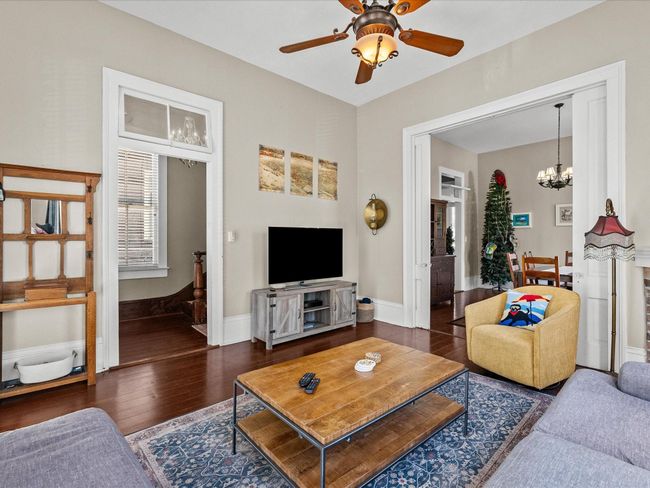 Beautiful pocket doors divide the living and dining | Image 25