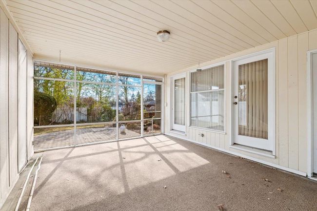 View of unfurnished sunroom | Image 9