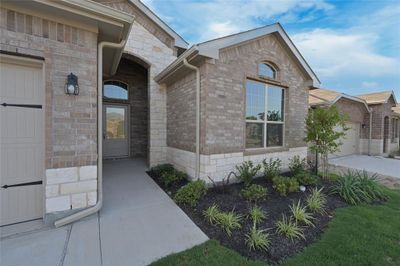 Covered front Porch & landscaped yard | Image 2