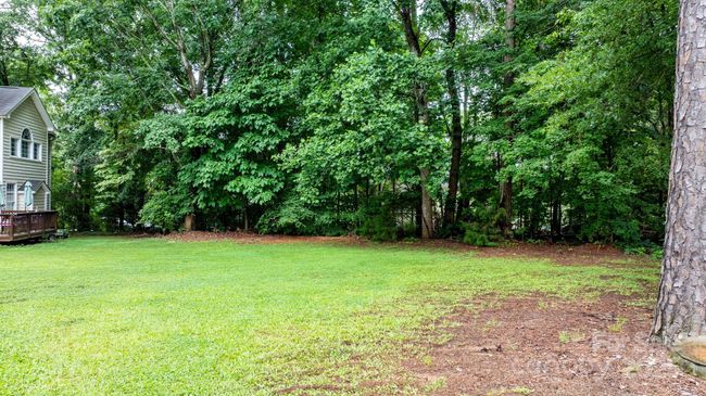 Flat back yard with room for a pool if desired | Image 37