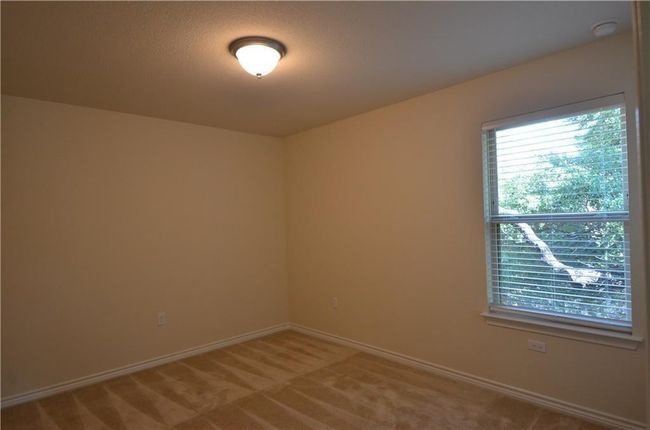 Spare room with carpet flooring and a smoke detector | Image 20