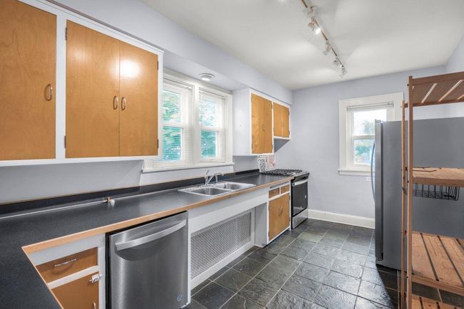Upper level kitchen with tiled floors and stainless steel appliances | Image 20