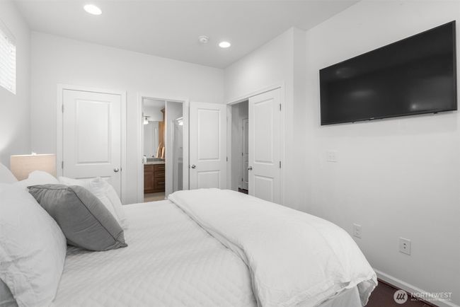 Like a second primary suite, French doors open to the main floor bedroom w/walk-in closet and adjoining 3/4 bath! | Image 15