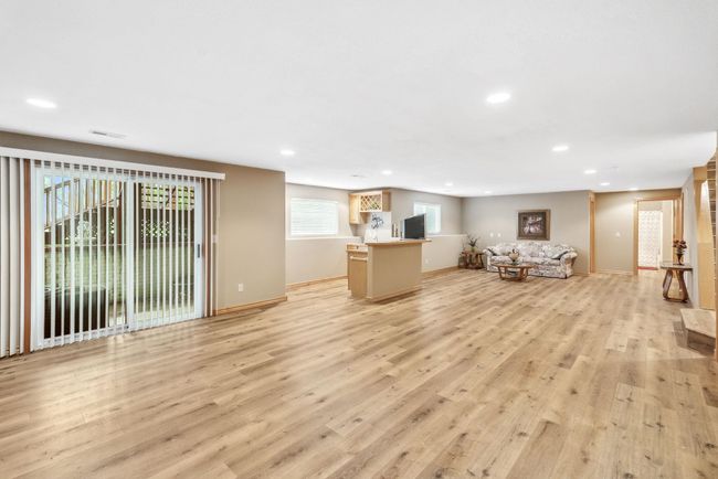Living room with recessed lighting, light wood-style floors, and baseboards | Image 18