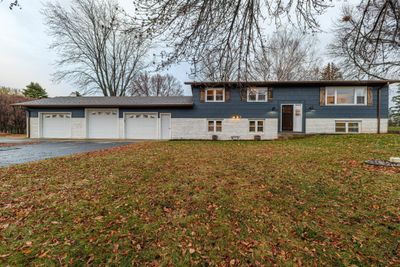 Driveway was re-sealed in 2023, new custom wood shutters, fresh limewash on brick, and siding has been painted. | Image 2