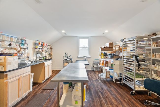 Home office featuring dark wood-style floors, vaulted ceiling, baseboards, and recessed lighting | Image 40