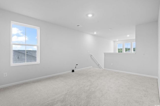 Carpeted spare room featuring baseboards and recessed lighting | Image 12