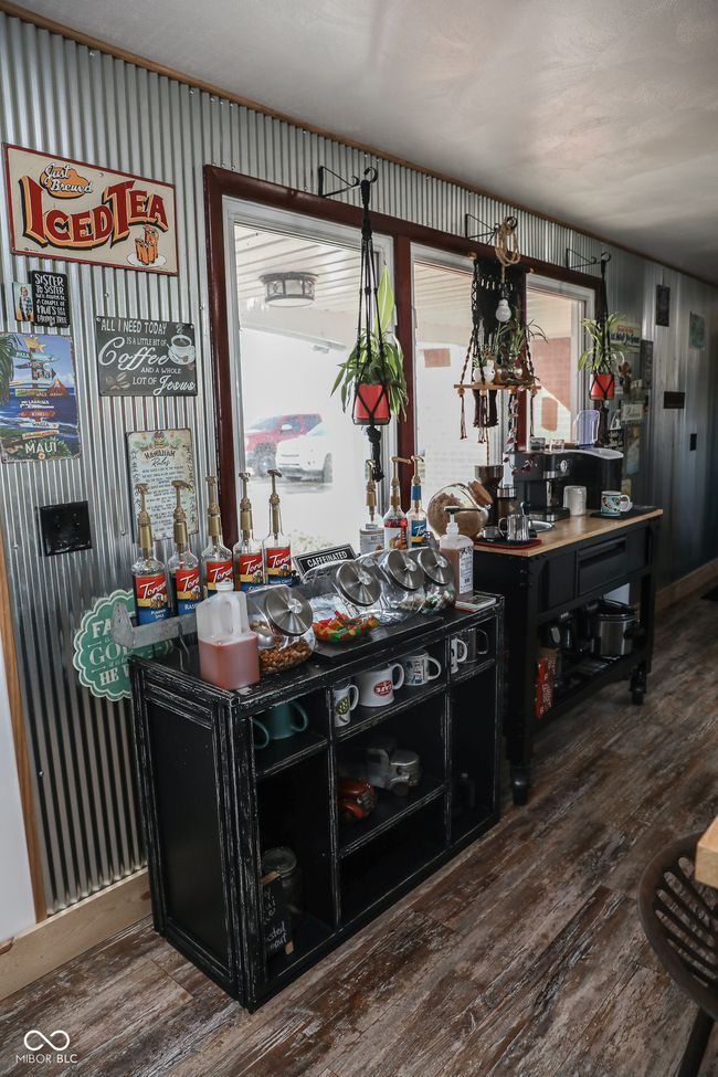 Coffee bar with plenty of natural light and wood finished floors | Image 25