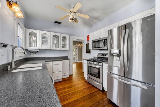 Sunny kitchen overlooks backyard | Image 8