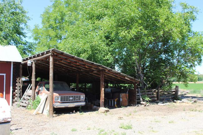 View of parking featuring a carport | Image 14