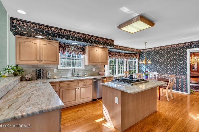 Kitchen with granite counters and island | Image 11