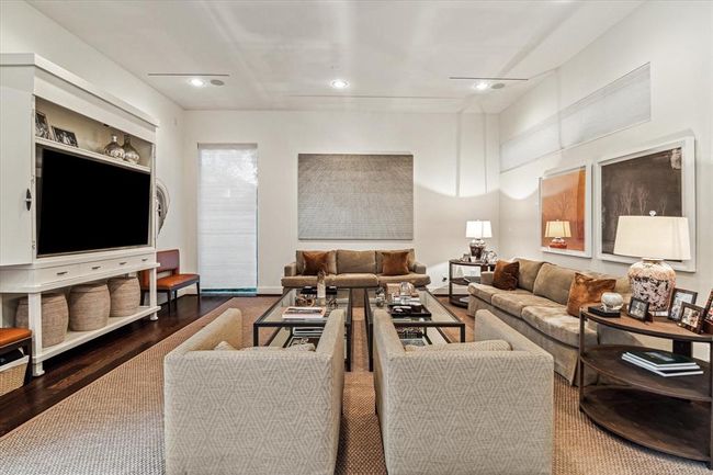 The spacious FAMILY ROOM (21 X 21) features wide plank hardwood flooring, recessed lighting, horizontal window with shade and corner window with shade. Ample supply of wall space for art work lovers! | Image 16