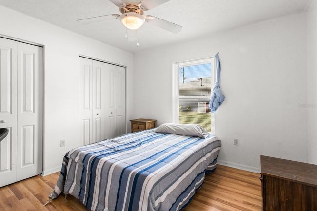 Bedroom 2 w/ 2 sets of Double BiFold Doors | Image 29