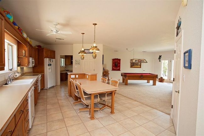 Bedroom with carpet and ceiling fan | Image 24