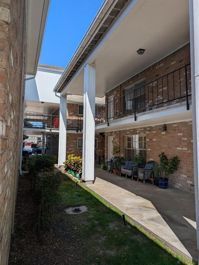 Walk way from one of the courtyards to the front door | Image 21