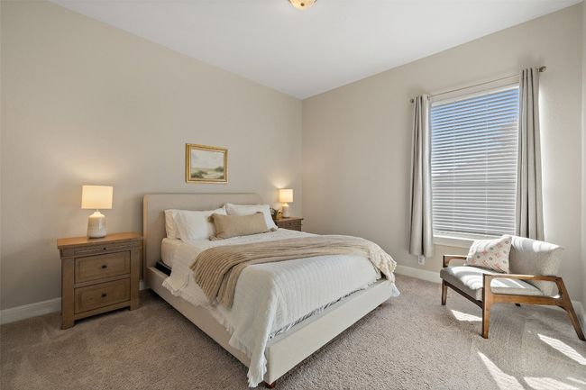Bedroom with baseboards, multiple windows, and light colored carpet | Image 20