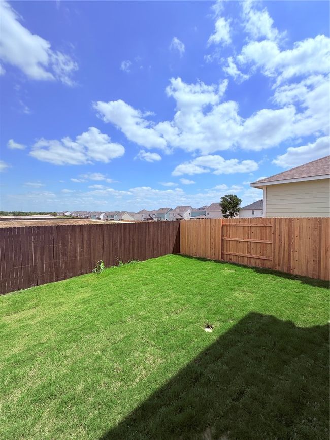 View of yard with a fenced backyard | Image 38