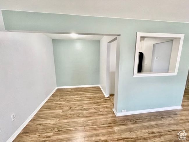 Interior space featuring wood finished floors and baseboards | Image 4
