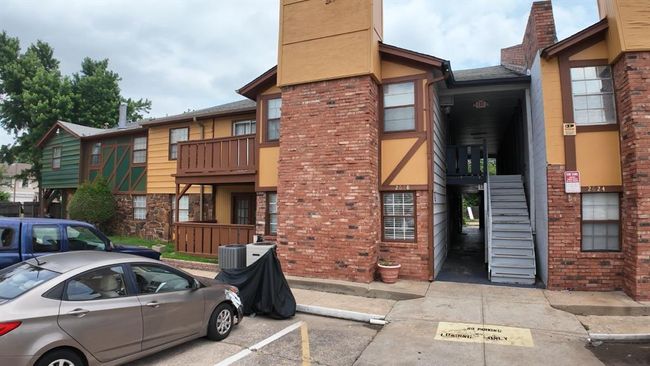 View of property with stairs and uncovered parking | Image 13
