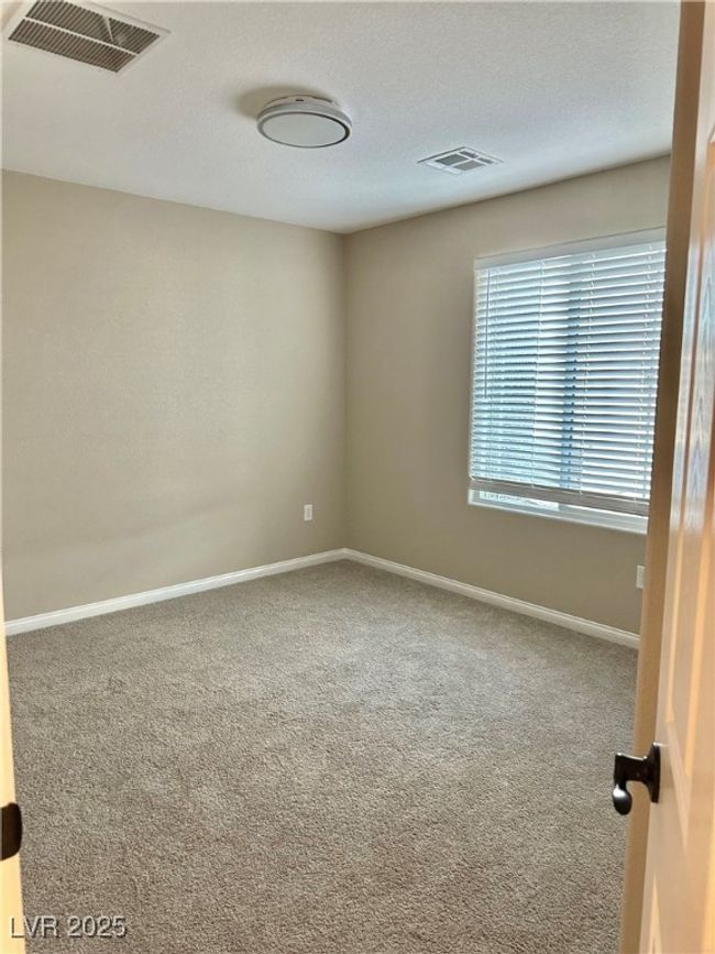 Unfurnished room with baseboards, a textured ceiling, visible vents, and carpet flooring | Image 24