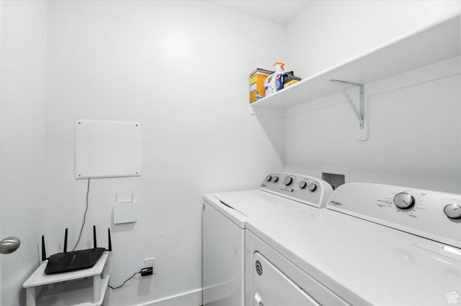 Laundry room featuring washer and clothes dryer | Image 14