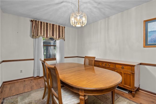 Dining room with chandelier | Image 12