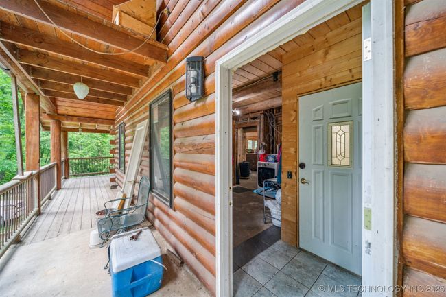 Entry thru mud room - second door leads to walkout basement with safe room | Image 15