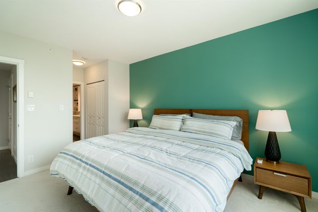 Carpeted bedroom with a closet and baseboards | Image 19