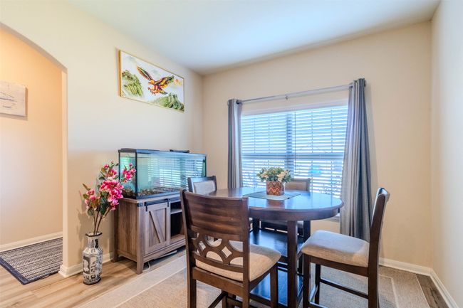 Dining space with light hardwood / wood-style flooring | Image 6