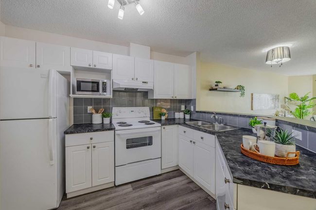1311 - 950 Arbour Lake Rd Nw, Condo with 2 bedrooms, 1 bathrooms and 1 parking in Calgary AB | Image 9