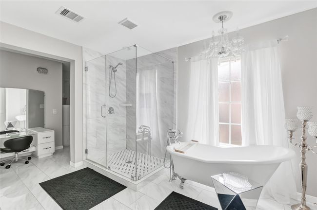 Amazing free standing tub, enormous shower, and a great dressing area make this your own personal spa! | Image 18