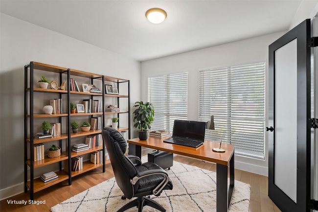 Home office with baseboards and wood finished floors | Image 5