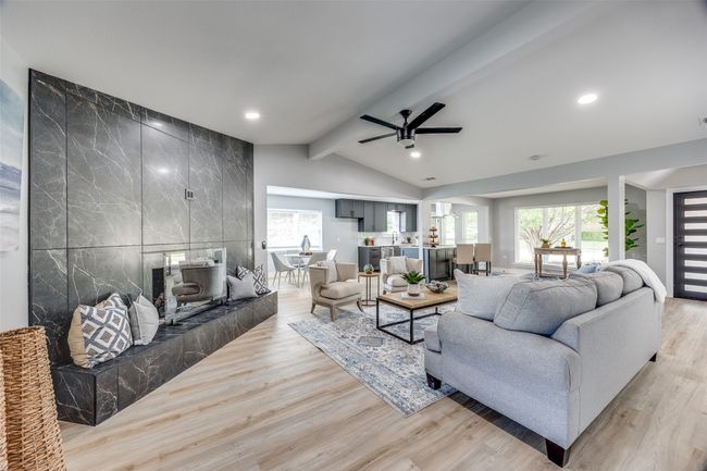 Living room featuring plenty of natural light, a ceiling fan, light wood-style floors, and recessed lighting | Image 7