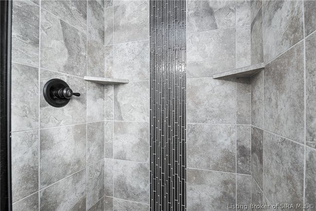 Gorgeous tiled shower with toiletry shelves! | Image 21