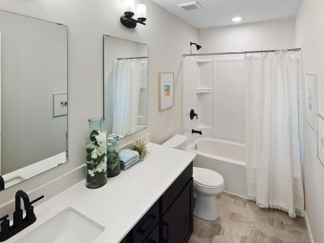 Bathroom 2 on the upper level is both functional and stylish, featuring modern fixtures and a well-designed layout to accommodate the needs of family and guests with ease. | Image 30