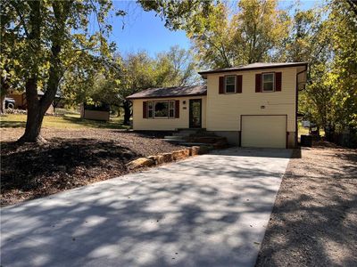 Tri-level home featuring a garage | Image 1