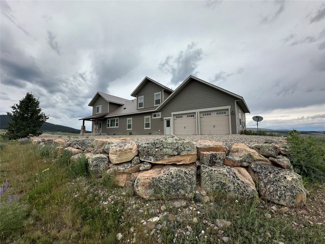 View of front of property with an attached garage | Image 35