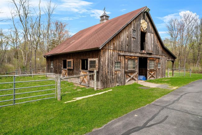 View of barn with an exterior structure | Image 38